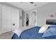 Cozy bedroom with double closets, neutral paint, and soft bedding for a relaxing space at 16828 Sanctuary Dr, Winter Garden, FL 34787