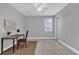 Minimalist bedroom with a ceiling fan, a view from the window, and carpet at 16828 Sanctuary Dr, Winter Garden, FL 34787