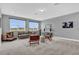 Bright bonus room with large windows, neutral carpet, and comfortable seating arrangements at 16828 Sanctuary Dr, Winter Garden, FL 34787