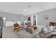 Cozy bonus room with kitchenette, carpeted floors and space for play and relaxation at 16828 Sanctuary Dr, Winter Garden, FL 34787