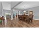 Open-concept dining room featuring a large wooden table with seating for ten, connected to the living space at 16828 Sanctuary Dr, Winter Garden, FL 34787