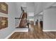 Spacious entryway features hardwood floors leading to the living areas and a staircase to the second floor at 16828 Sanctuary Dr, Winter Garden, FL 34787
