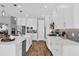 Spacious white kitchen with stainless steel appliances and long countertops at 16828 Sanctuary Dr, Winter Garden, FL 34787