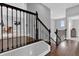 Second floor landing features decorative railing, hardwood floors, and doorways to the bedrooms at 16828 Sanctuary Dr, Winter Garden, FL 34787