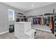Organized walk-in closet with custom shelving, drawers, and ample storage space for clothing at 16828 Sanctuary Dr, Winter Garden, FL 34787