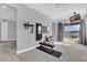 Spacious workout room with gym equipment, a wall-mounted mirror, and sliding glass doors to the pool area at 16828 Sanctuary Dr, Winter Garden, FL 34787