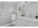 Elegant bathroom with a glass shower enclosure, modern fixtures, and marble-style tile at 180 Stanley Bell Dr, Mount Dora, FL 32757