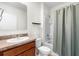 Clean bathroom featuring a vanity with a granite countertop and a shower-tub combo at 2024 Griffin Oaks Way, Tavares, FL 32778