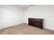 Bedroom showcasing a dark wood dresser on plush carpet at 2024 Griffin Oaks Way, Tavares, FL 32778