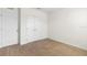 Neutral-toned bedroom with carpet flooring, a closet, and natural light at 2024 Griffin Oaks Way, Tavares, FL 32778