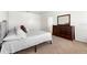 Comfortable bedroom with a dresser and ample closet space provides a cozy retreat at 2024 Griffin Oaks Way, Tavares, FL 32778