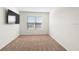 This bedroom has plush carpet and a tv on the wall at 2024 Griffin Oaks Way, Tavares, FL 32778