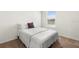 Cozy bedroom features a comfortable queen bed, plush carpet, and bright window at 2024 Griffin Oaks Way, Tavares, FL 32778