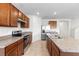 Bright kitchen featuring granite countertops and stainless steel appliances at 2024 Griffin Oaks Way, Tavares, FL 32778