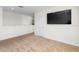 Loft featuring a large television, plush carpet, and neutral walls at 2024 Griffin Oaks Way, Tavares, FL 32778