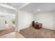 Bright home office with neutral carpet, white walls, and modern desk at 2024 Griffin Oaks Way, Tavares, FL 32778