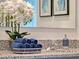 The bright, airy bathroom features granite countertops, double vanity sinks, and modern faucets at 2219 Lake Preserve Cir, New Smyrna Beach, FL 32168