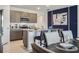 Contemporary kitchen with gray cabinets, stainless steel appliances, and granite countertops with bar seating at 2219 Lake Preserve Cir, New Smyrna Beach, FL 32168