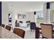 Bright living room with modern furnishings and decor, with an open view into the bedroom at 2219 Lake Preserve Cir, New Smyrna Beach, FL 32168