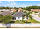Drone view of home with fenced yard and palm tree, set in a quiet neighborhood at 239 Bronze Leaf Ct, Apopka, FL 32703