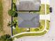 Bird's eye view of the home showing the roof, backyard with playset, and surrounding landscape at 239 Bronze Leaf Ct, Apopka, FL 32703