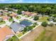 Aerial view featuring homes with green lawns and manicured landscapes, showing an idyllic neighborhood setting at 239 Bronze Leaf Ct, Apopka, FL 32703