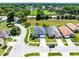 Aerial view of a neighborhood showcasing the home's location on a well-manicured lot at 239 Bronze Leaf Ct, Apopka, FL 32703