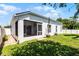 Backyard with a screened in porch and an open patio area at 239 Bronze Leaf Ct, Apopka, FL 32703