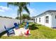 Large backyard with lush green grass, a swing set and plenty of room for outdoor enjoyment at 239 Bronze Leaf Ct, Apopka, FL 32703