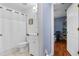 Bright bathroom with a sink and shower next to a bedroom at 239 Bronze Leaf Ct, Apopka, FL 32703
