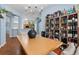 Charming dining room showcasing a dining table, hardwood floors, and a unique built-in wine rack at 239 Bronze Leaf Ct, Apopka, FL 32703