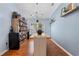 Bright dining room with wood floors, a large window, and a built-in wine rack offers elegance at 239 Bronze Leaf Ct, Apopka, FL 32703