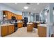 Spacious kitchen featuring a functional island, stainless steel appliances and ample cabinet space at 239 Bronze Leaf Ct, Apopka, FL 32703