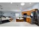 Open kitchen with stainless appliances, island, and view into the connected living room at 239 Bronze Leaf Ct, Apopka, FL 32703