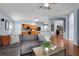 Living room showing the flow to the kitchen and dining areas at 239 Bronze Leaf Ct, Apopka, FL 32703