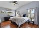 Serene bedroom features a comfortable bed, vaulted ceilings, and ample natural light from multiple windows at 239 Bronze Leaf Ct, Apopka, FL 32703