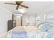 Bedroom with a ceiling fan, dresser and connected bathroom at 2413 Weber St, Orlando, FL 32803