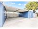 Spacious blue carport with ample parking and storage, ideal for boats or recreational vehicles at 2413 Weber St, Orlando, FL 32803