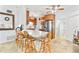 Bright kitchen featuring breakfast bar, stainless appliances, granite countertops, and open layout to dining and office spaces at 2413 Weber St, Orlando, FL 32803