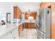 Updated kitchen with stainless steel appliances, granite countertops, custom cabinets and pendant lighting at 2413 Weber St, Orlando, FL 32803