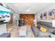 Cozy living room with wood accent wall, fireplace and tile floors at 2413 Weber St, Orlando, FL 32803