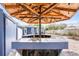 Outdoor bar with overhead structure, featuring a sink and tile countertop, great for entertaining in the backyard at 2413 Weber St, Orlando, FL 32803