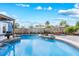 A kidney-shaped pool featuring an accent water feature enhances outdoor enjoyment and complements the home's design at 2413 Weber St, Orlando, FL 32803