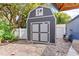 Backyard storage shed offers practical space for storing outdoor equipment and tools in a well-maintained yard at 2413 Weber St, Orlando, FL 32803