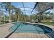 Large screened-in pool with outdoor furniture and a spacious deck at 243 Shady Oaks Cir, Lake Mary, FL 32746