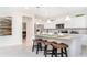 Modern kitchen featuring white cabinets, stainless steel appliances, and granite countertops at 2486 Dubai St, Kissimmee, FL 34747