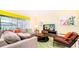 Inviting living room with comfortable seating, modern decor, and bright natural light at 2486 Dubai St, Kissimmee, FL 34747