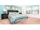 Tranquil main bedroom featuring a king bed with coastal-inspired decor and ample natural light at 2486 Dubai St, Kissimmee, FL 34747