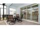 Covered patio with outdoor seating and a view of the backyard and sliding glass doors at 2486 Dubai St, Kissimmee, FL 34747