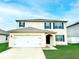 Charming two-story home with a well-manicured lawn, two-car garage, and lovely curb appeal at 2837 Palatino Lane, Tavares, FL 32778